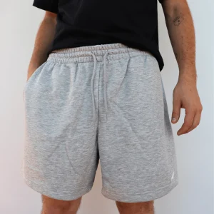 NEW BALANCE PANTALONCINI FELPA MS41520 GRIGIO